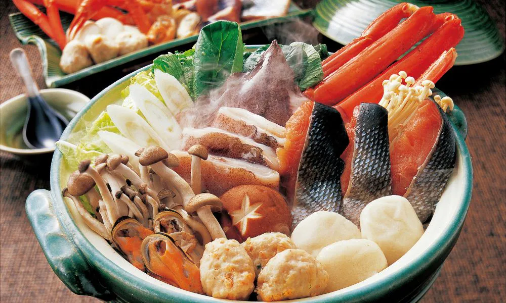 Assorted seafood hot pot with fish, mushrooms, and vegetables at SANKU MAOTS'AI-LA, a Chinese Restaurant in City of Industry